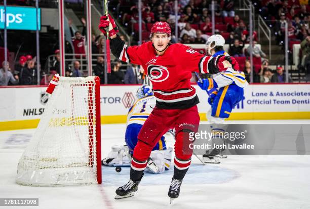 Martin Necas of the Carolina Hurricanes celebrates after scoring the game-winning goal in overtime against the Buffalo Sabres at PNC Arena on...