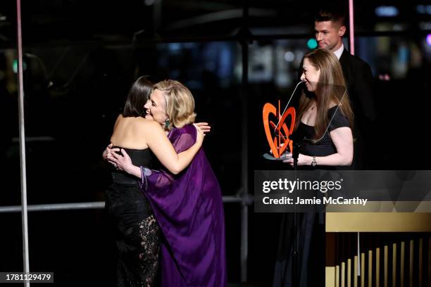 Hillary Rodham Clinton and Chelsea Clinton present an award to America Ferrera onstage during Glamour Women of the Year 2023 at Jazz at Lincoln...