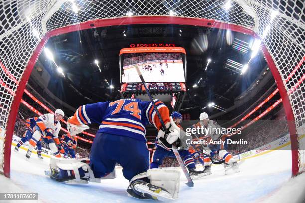 Stuart Skinner of the Edmonton Oilers makes a save during the third period against the New York Islanders at Rogers Place on November 13 in Edmonton,...