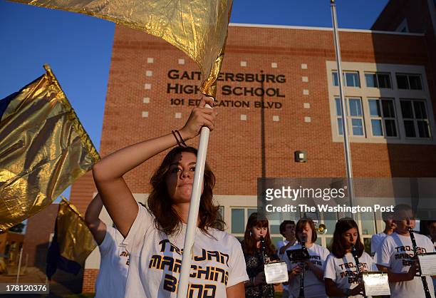 Heather Bokelman senior, of the marching band of Gaithersburg High School and her fellow band members welcome students outside the new school...