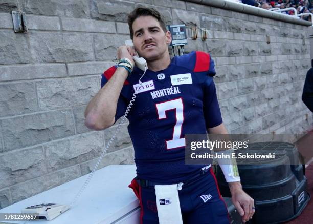 Cody Fajardo of the Montreal Alouettes talks to his spotters during agame against the Hamilton Tiger-Cats at Percival Molson Stadium on November 4,...