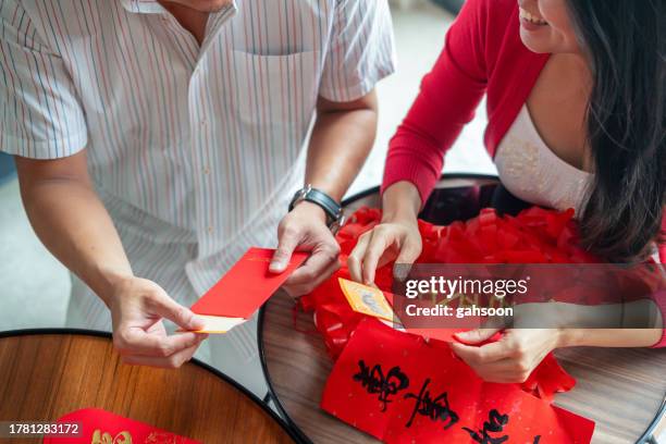 red packet preparation chinese new year - married money stock pictures, royalty-free photos & images