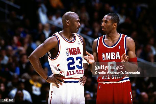 Kobe Bryant of the Western Conference All Stars talks with Michael Jordan of the Eastern conference All Stars during the 2003 NBA All-Star Game at...