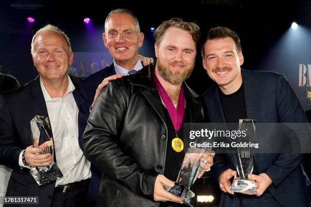 Troy Tomlinson, BMI President & CEO, Mike O'Neill, Ernest Keith Smith and Morgan Wallen onstage during the 2023 BMI Country Awards at BMI Nashville...