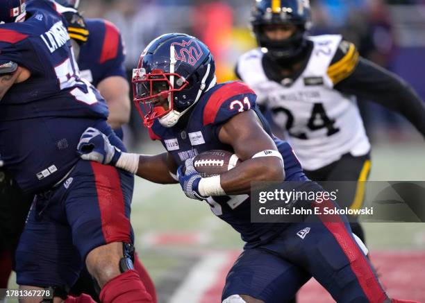 William Stanback of the Montreal Alouettes rushes the football against the Hamilton Tiger-Cats at Percival Molson Stadium on November 4, 2023 in...