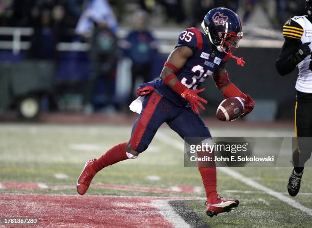 Reggie Stubblefield of the Montreal Alouettes tries to get control of a tipped pass against the Hamilton Tiger-Cats at Percival Molson Stadium on...