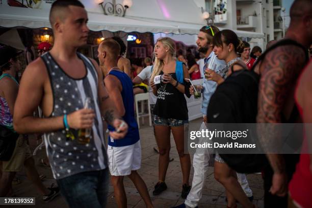 Girl distributes flyers outside Cafe del Mar in San Antonioo on August 21, 2013 in Ibiza, Spain. The small island of Ibiza lies within the Balearics...