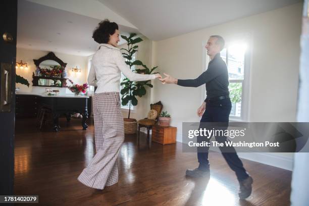 Victoria Barnes and Paul Keifrider dance the cha cha inside their recently renovated Victorian home located just outside of Philadelphia in...