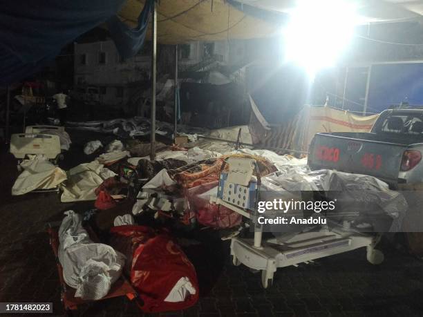 Bodies of Palestinians are seen in front of Al-Shifa Hospital in Gaza City, Gaza on November 13, 2023. According to the Health Ministry spokesman...