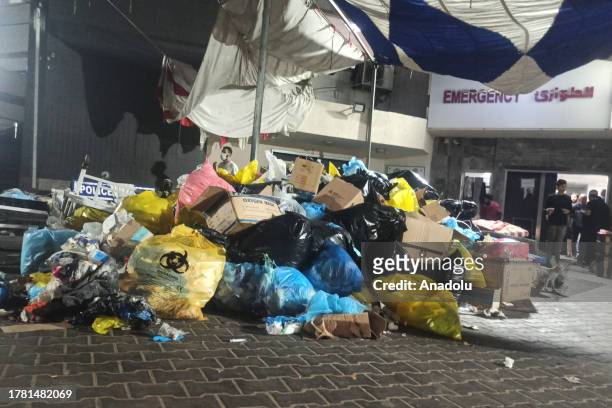 Piles of waste and trash are accumulated in front of Al-Shifa Hospital in Gaza City, Gaza on November 13, 2023. According to the ministry's spokesman...