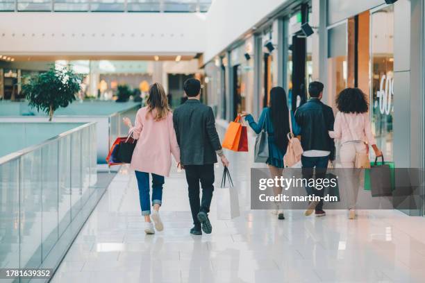 friends in the shopping mall - back friday stock pictures, royalty-free photos & images