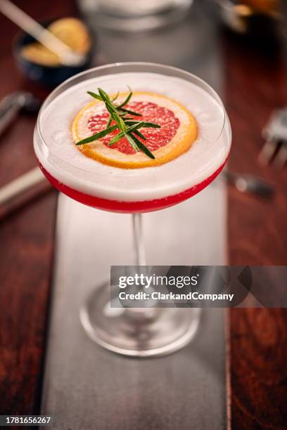 campari sour with grapefruit and rosemary - garnish stock pictures, royalty-free photos & images