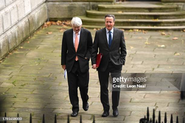 Minister for Development in the Foreign Office, Andrew Mitchell , and Britain's new Foreign Secretary, former Prime Minister, David Cameron , arrive...