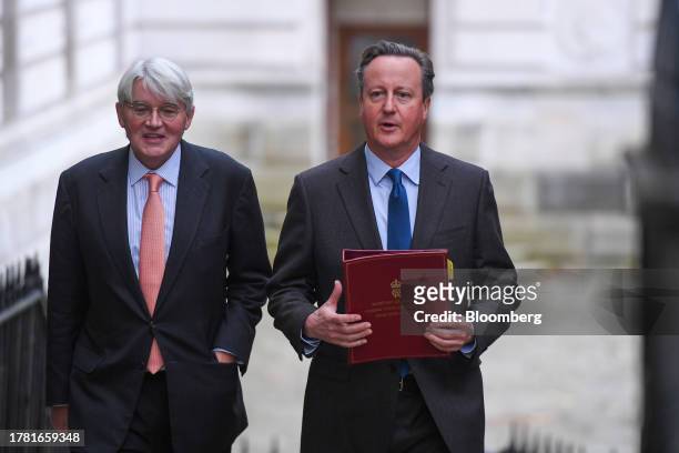 David Cameron, UK foreign secretary, right, and Andrew Mitchell, UK development minister, arrive for a meeting of cabinet ministers at 10 Downing...