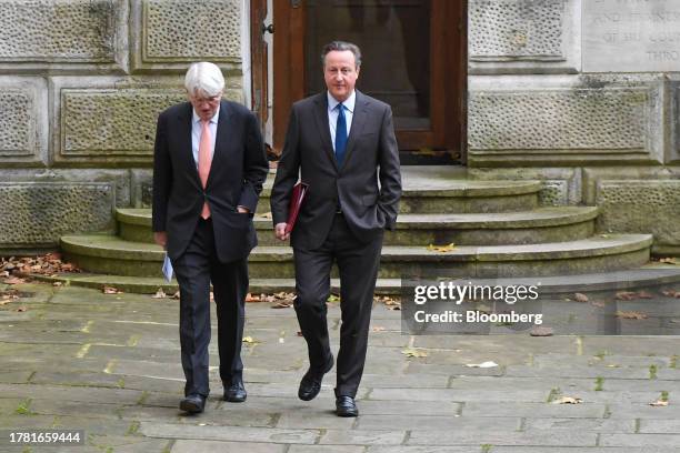 David Cameron, UK foreign secretary, right, and Andrew Mitchell, UK development minister, arrive for a meeting of cabinet ministers at 10 Downing...