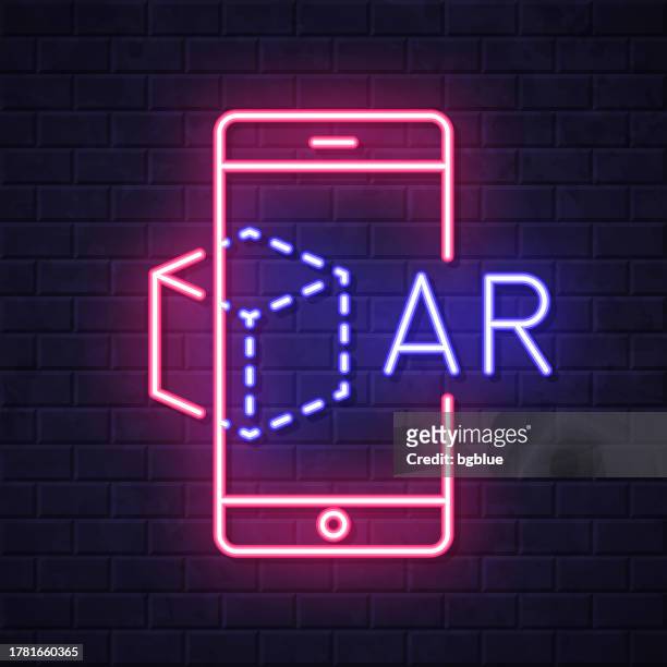 ar augmented reality with smartphone. glowing neon icon on brick wall background - 360 tablet stock illustrations