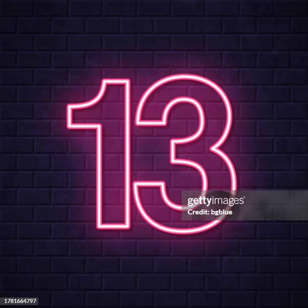 13 - number thirteen. glowing neon icon on brick wall background - number 13 stock illustrations