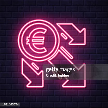 Euro decrease. Glowing neon icon on brick wall background Euro decrease. Glowing neon icon on brick wall background
