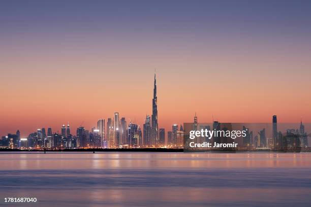 dubai urban skyline at golden dusk - dubai bildbanksfoton och bilder