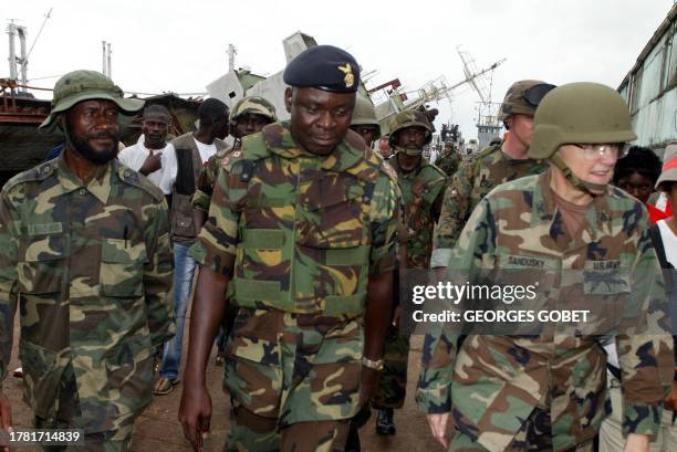 Military attache in Liberia, Colonel Sue Ann Sandusky is accompanied by Ghanean colonel Theophilus Tawiah head of the ECOMIL , the West African...