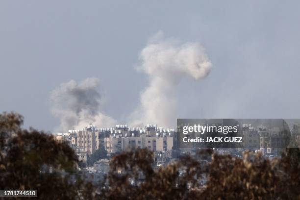 This picture taken from a position along the border with the Gaza Strip in southern Israel shows smoke billowing during Israeli shelling amid ongoing...