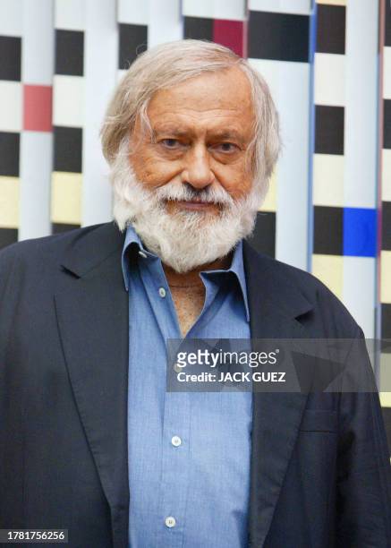 Photo of Agam Yaacov, Israeli artist, in front of one of his works at the Georges Pompidou Art Center 28 June 2003 in Paris where kinetic sculpture...