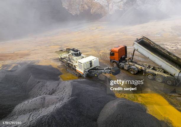 aerial view of crushed stone quarry machine - yellow belt stock pictures, royalty-free photos & images