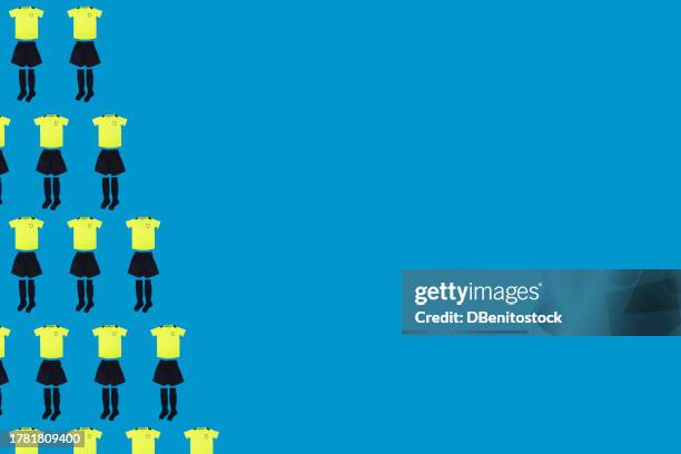 soccer equipment kit pattern, bright yellow t-shirt and black pants and socks, on the left side, on a blue background. concept of sport, soccer ball, uniform, world cup and team. - graphic print fabric stock pictures, royalty-free photos & images