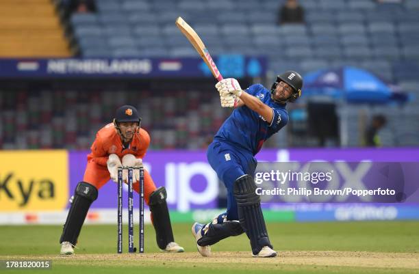 Dawid Malan of England hits out watched by Scott Edwards during the ICC Men's Cricket World Cup India 2023 between England and Netherlands at MCA...