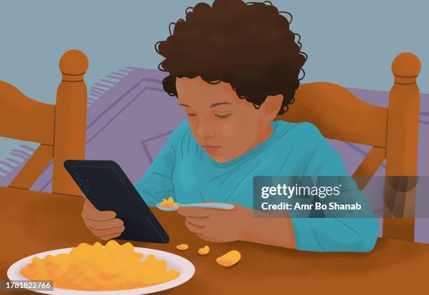 stockillustraties, clipart, cartoons en iconen met messy, distracted boy eating macaroni and cheese and using smart phone at dining table - macaroni en kaas