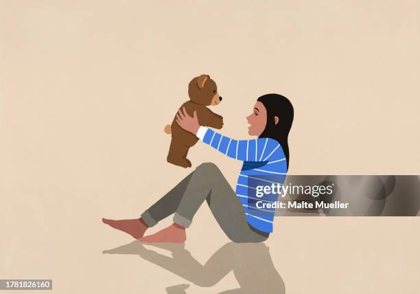 girl playing with teddy bear on peach background - peach background stock illustrations