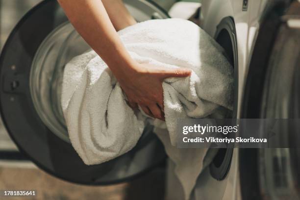 clothes in the washing machine - toalha imagens e fotografias de stock