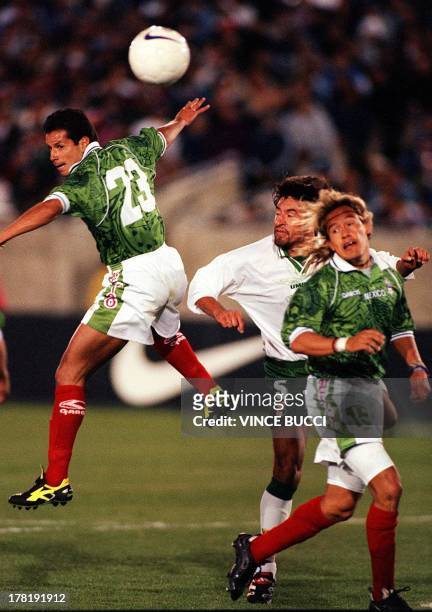 Jose Manuel Abundis of Mexico misses a pass as teammate Luis Hernandez and Oscar Sanchez of Bolivia watch during their Nike U.S. Cup soccer match 11...