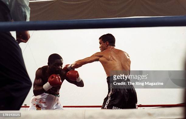 Jeff Fenech throws a punch against Azumah Nelson during the fight at Princes Park Football Ground in Melbourne, Australia. Azumah Nelson won the WBC...