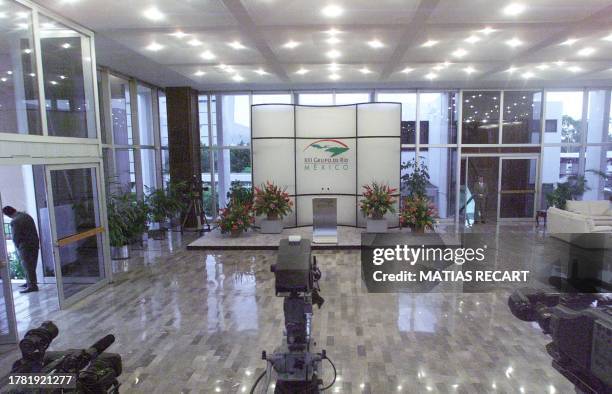 Mexican security agents keep watch over the area of the conference room in the presidential hangar of the international airport in Mexico City....