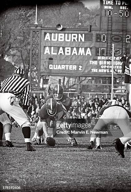 Iron Bowl: Alabama QB Pat Trammell at line of scrimmage during game vs Auburn at Legion Field. View of scoreboard in background. Birmingham, AL...