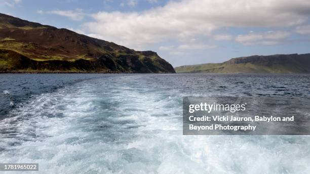 wake of ship near harbor of portree, isle of skye on beautiful spring day - beyond stock pictures, royalty-free photos & images