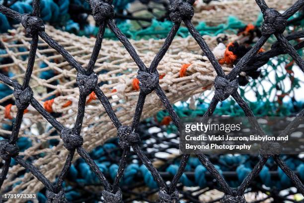 close up abstract fishing nets in portree, isle of skye, scotland - beyond stock pictures, royalty-free photos & images
