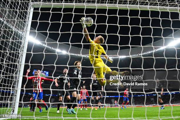 Joe Hart of Celtic makes a save during the UEFA Champions League match between Atletico Madrid and Celtic FC at Civitas Metropolitano Stadium on...