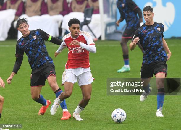 Lino Sousa of Arsenal takes on Alberto Collado of Sevilla durin the UEFA Youth League match between Arsenal U19 and Sevilla U19 at Meadow Park on...