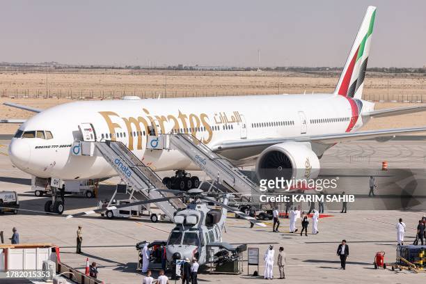 An Emirates Boeing 777-300ER aircraft is pictured on the tarmac during the 2023 Dubai Airshow at Dubai World Central - Al-Maktoum International...