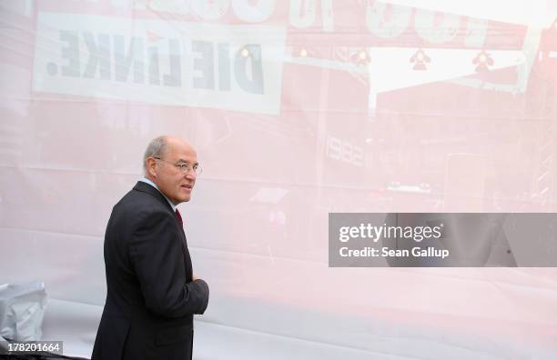 Gregor Gysi, Chairman of the Bundestag faction of the German left-wing party Die Linke, stands behind stage before speaking to supporters during an...