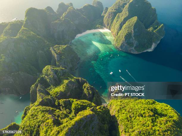 aerial view phi phi ley island with its beautiful maya bay and pileh lagoon in the andaman sea, where many tourists come to krabi, thailand. - ao nang fotografías e imágenes de stock