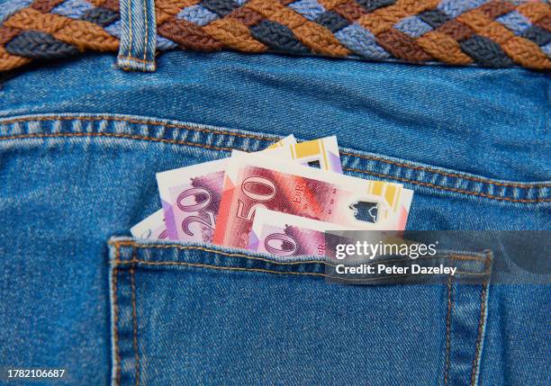 uk pound notes in pocket - 50 pound notes stock pictures, royalty-free photos & images