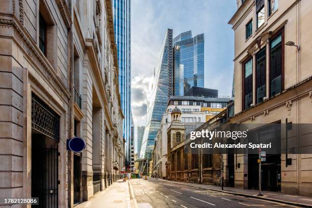 street in city of london financial district with shine glass skyscrapers, london, uk - commercial real estate as investment increases stock pictures, royalty-free photos & images