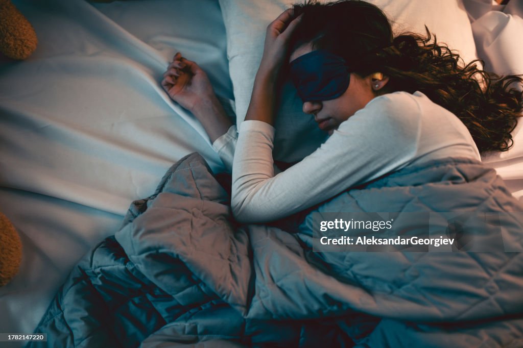 Female Getting Good Rest With The Help Of Sleeping Mask And Ear Plugs