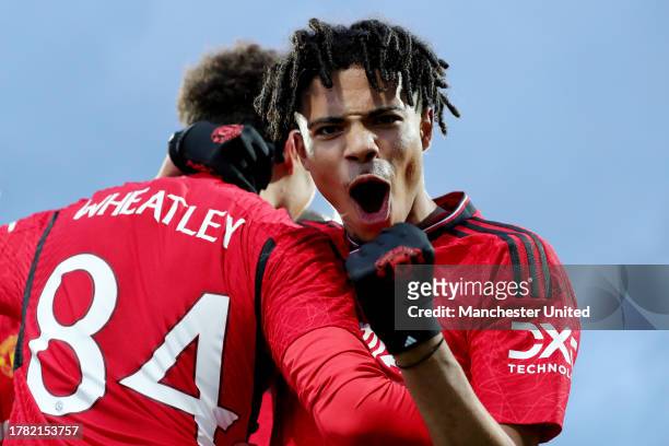 Ethan Wheatley of Manchester United celebrates with team mate Ethan Williams after scoring their sides second goal during the UEFA Youth League...