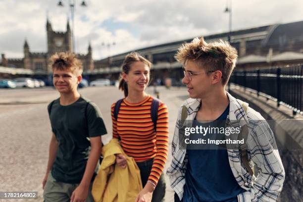 teenagers walking with by the bristol temple meads railroad station - bristol railway station stock pictures, royalty-free photos & images