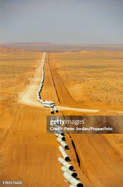 Aerial view of sections of pipework waiting to be joined together, sealed and buried during construction of the Maghreb-Europe Gas Pipeline in the...