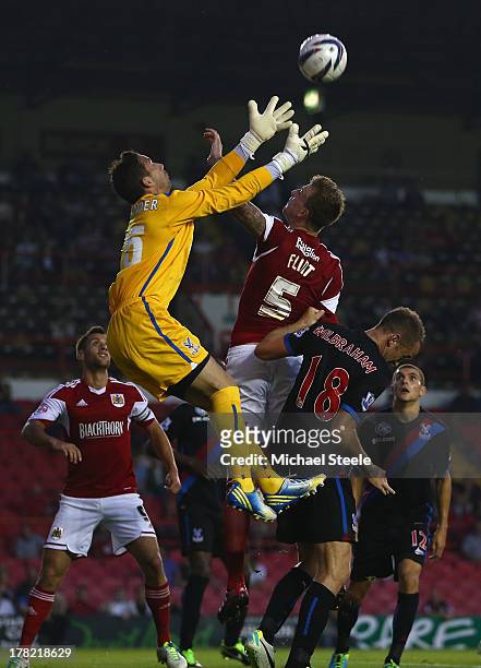 Aden Flint of Bristol City is sandwiched between Neil Alexander and Aaron Wilbraham of Crystal Palace during the Capital One Cup second round match...